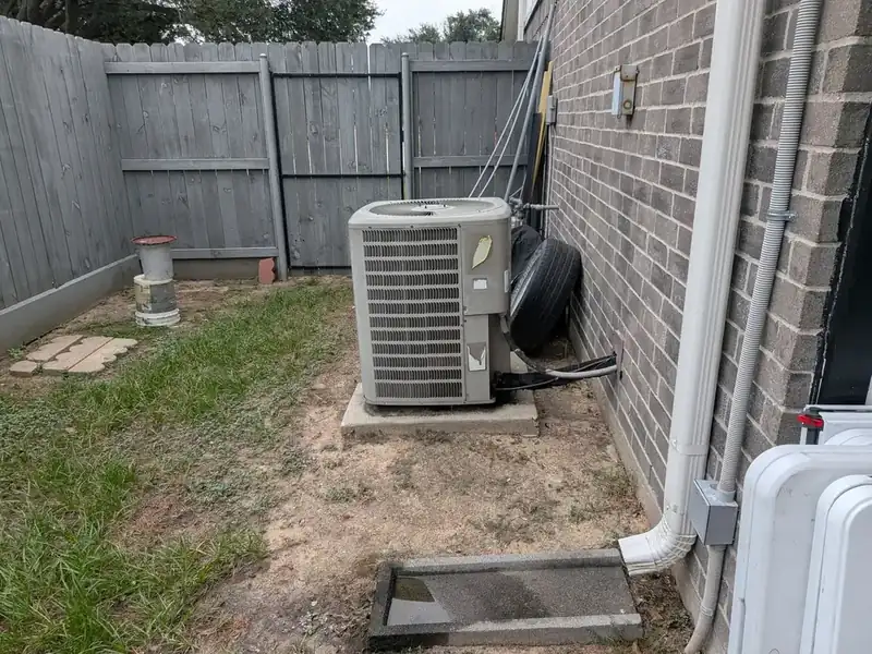 Goodman VSX130481AB outdoor air conditioner in a mixed-brand HVAC system